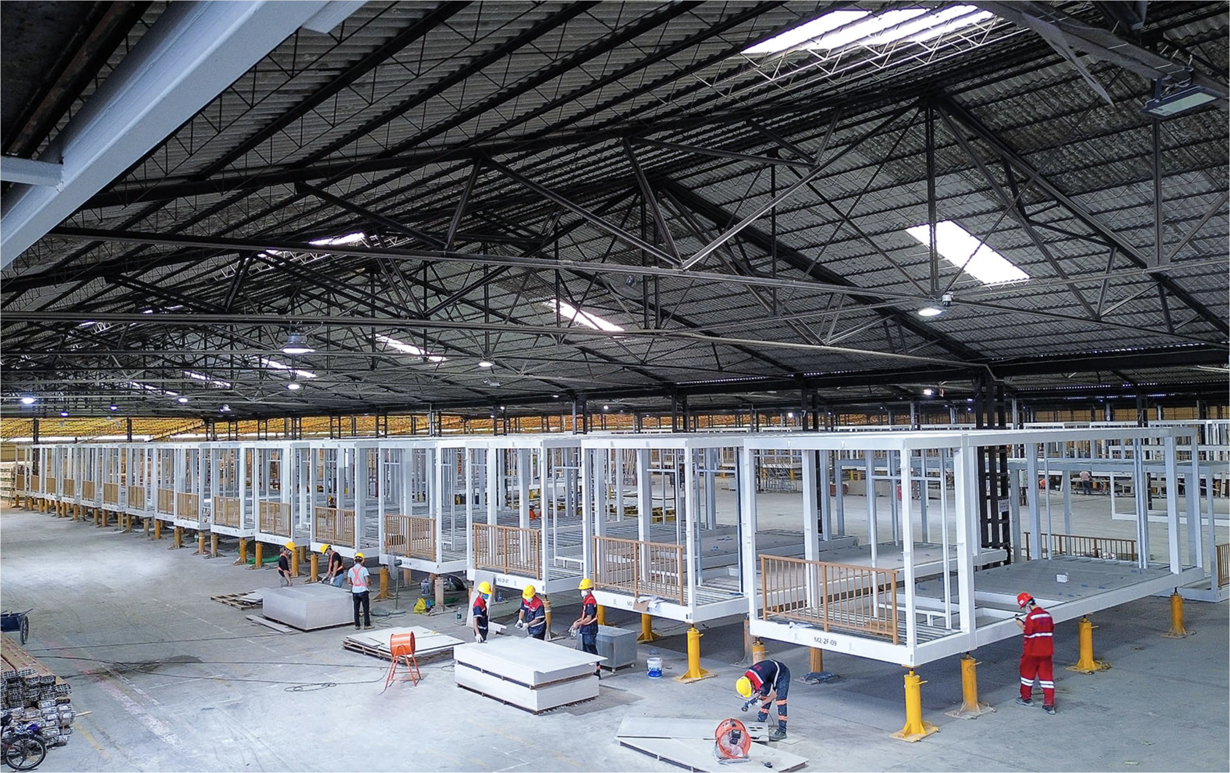 Modular production line — multiple steel-frame modules at fit-out stage